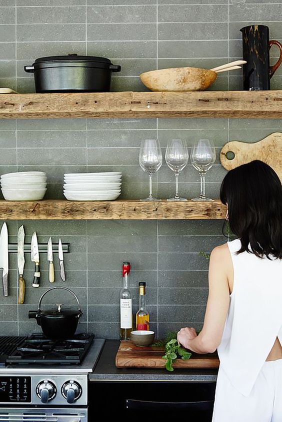 recalimed thick wooden shelves bring interest and coziness with their unique texture and look