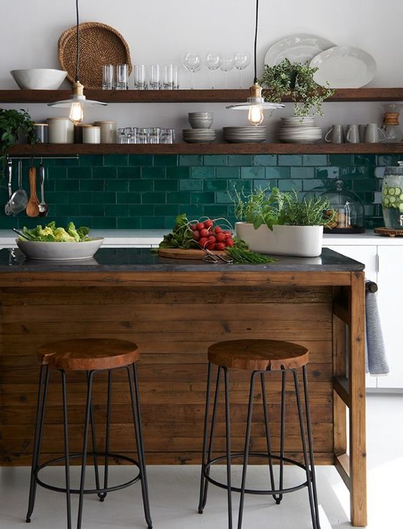 white cabinets plus a dark stained kitchen island with a grey marble countertop and matching wooden shelves