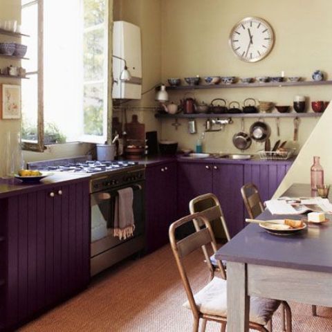 purple kitchen cabinets and cream walls look interesting