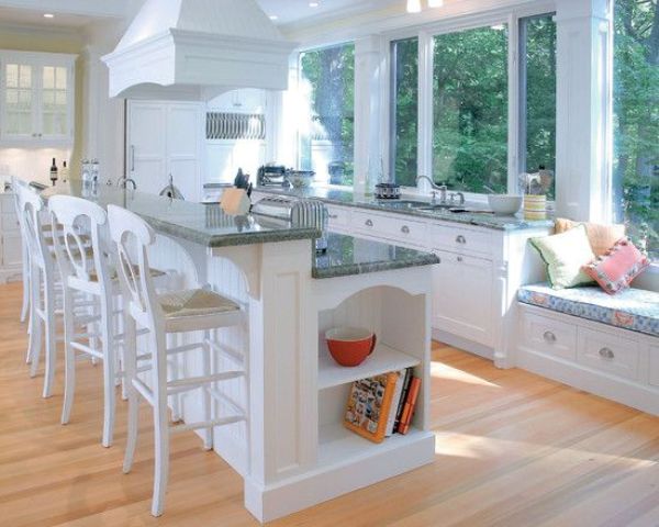 a two tier kitchen island with two tiers for cooking and eating fits perfectly in a traditional kitchen