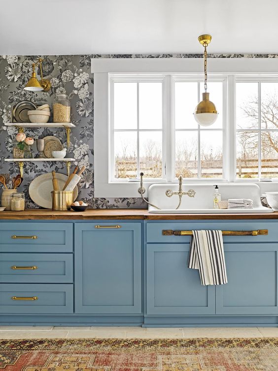 a beautiful one wall blue kitchen with floral wlalpaper, butcherblock countertops and pretty vintage pendant lamps a beautiful one wall blue kitchen with floral wlalpaper, butcherblock countertops and pretty vintage pendant lamps