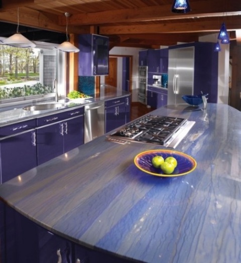 purple cabinets and striped purple and neutral stone countertops for a bright and colorful kitchen look