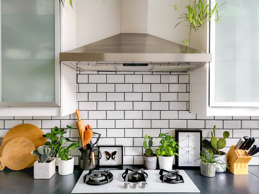 Black,And,White,Subway,Tiled,Kitchen,With,Numerous,Plants,And