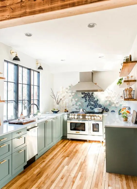 a-beautiful-green-U-shaped-kitchen-with-white-countertops-and-a-geometric-ombre-tile-backsplash-and-