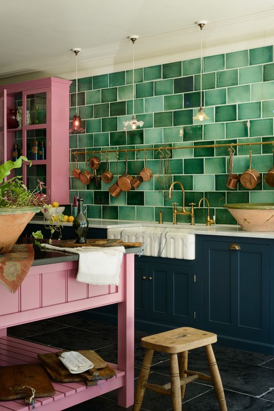 a bright kitchen with navy and pink cabinets_yythkg
