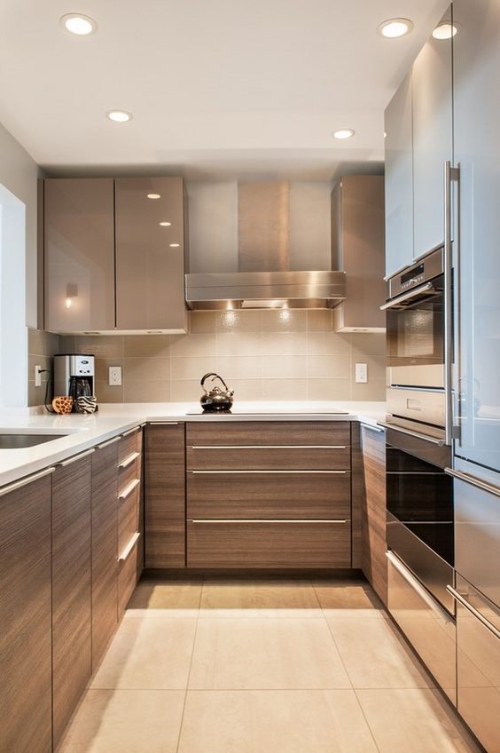 a brown U shape kitchen with appliances placed_yyth
