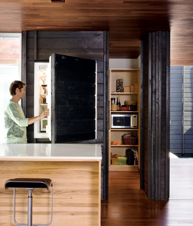 a fridge hidden inside a large cabinet doesn_t_yyth