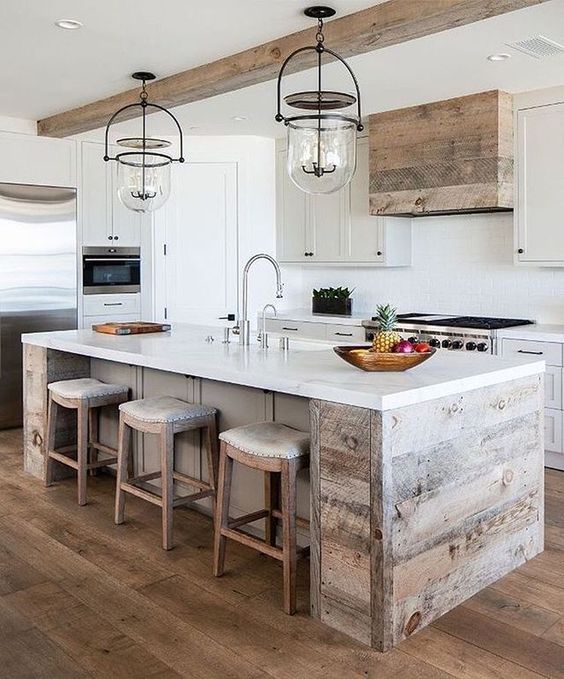 a neutral modern farmhouse kitchen with statement g