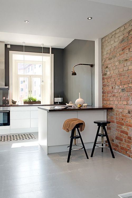 a small contemporary kitchen nook separated from th