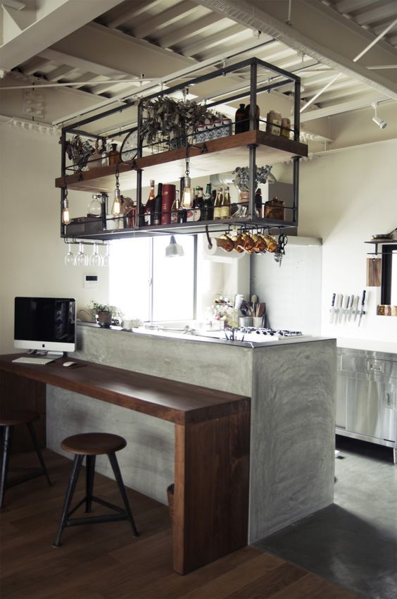 a small kitchen with an industrial shelving unit_yy