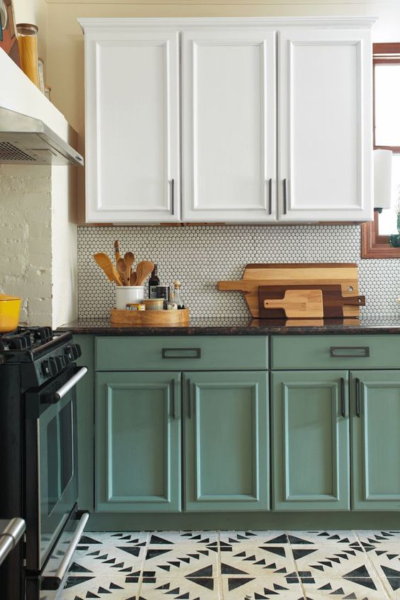 a trendy two-tone kitchen with upper white cabinets