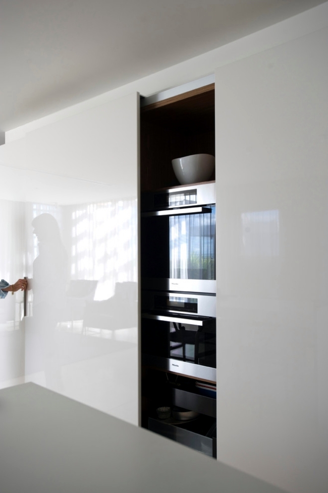 an oversized glossy sleek cabinet with a sliding_yy