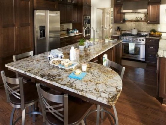 dark stained wooden cabinets and grey stone counter