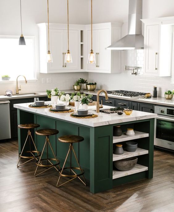 a black and white kitchen with a dark green_