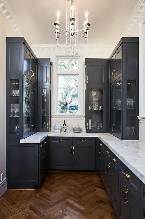 a small black vintage kitchen with white stone_yyth